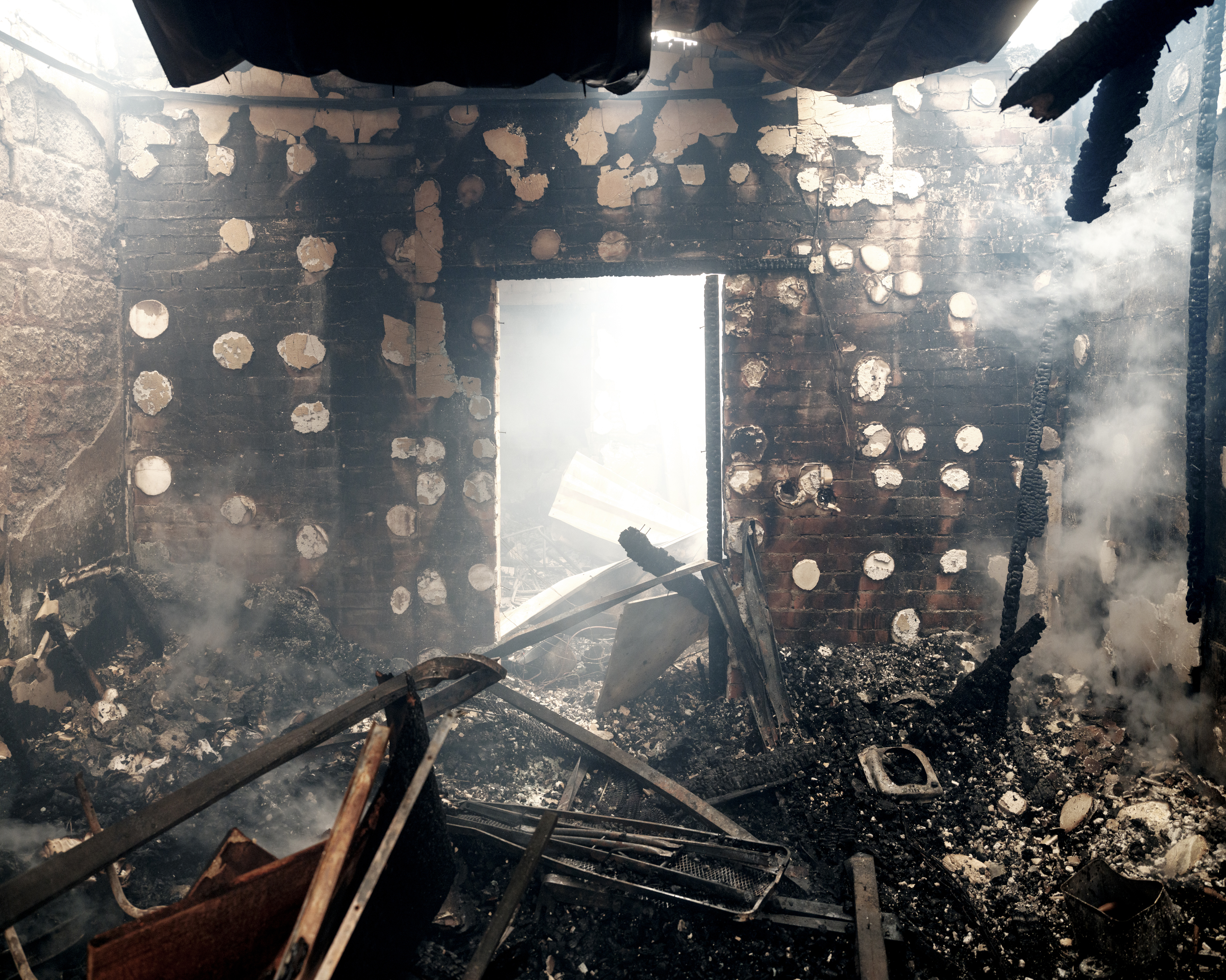 24 February 2022. Burning civilian houses hit by a rocket. MSF has been working in eastern Ukraine for the last eight years, trying to improve access to health care for remote, conflict-affected populations. 
