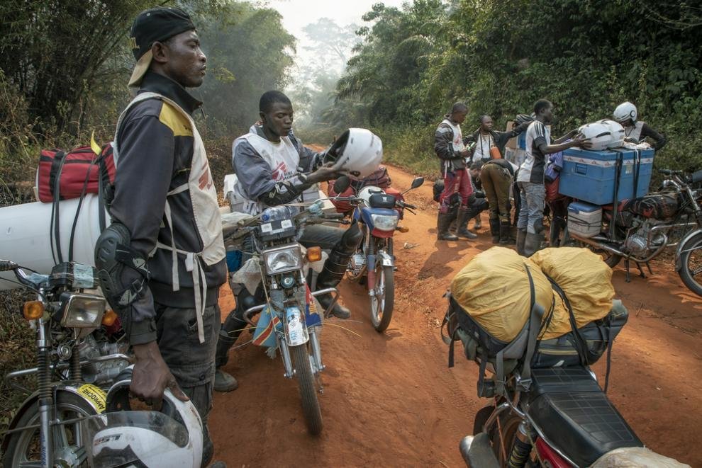 A measles vaccination team preparing to travel to a hard-to-reach area in northern DRC
