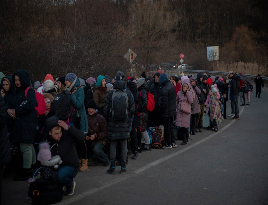 Hundreds of people wait in line to cross the border on foot into Slovakia from the city of Uzhhorod in Ukraine&#039;s Transcarpathia region. (March, 2022).