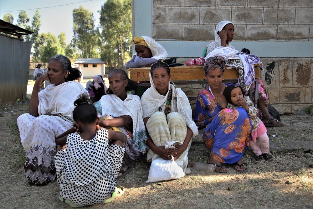 Displaced women pass the time at Kundeya school, in the city of Axum, where they have taken refuge from the conflict in the northern Ethiopian region of Tigray.