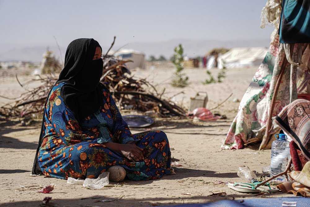 Abdu Sabit sits outside her tent. (December, 2021).