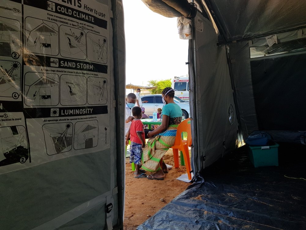Patients registering for health consultation at MSF&#039;s medical tent in Pemba Stadium, where IDPs from Palma are temporarily sheltered.