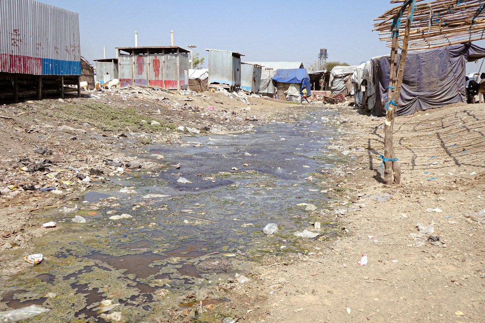 Water drains in the middle of shelters in Bentiu internally displaced persons camp.