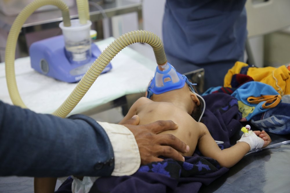 A child with breathing difficulties is put on a nebulizer in the emergency room (ER) of the Mother and Child hospital in Taiz Houban, southwestern Yemen. February 2020.