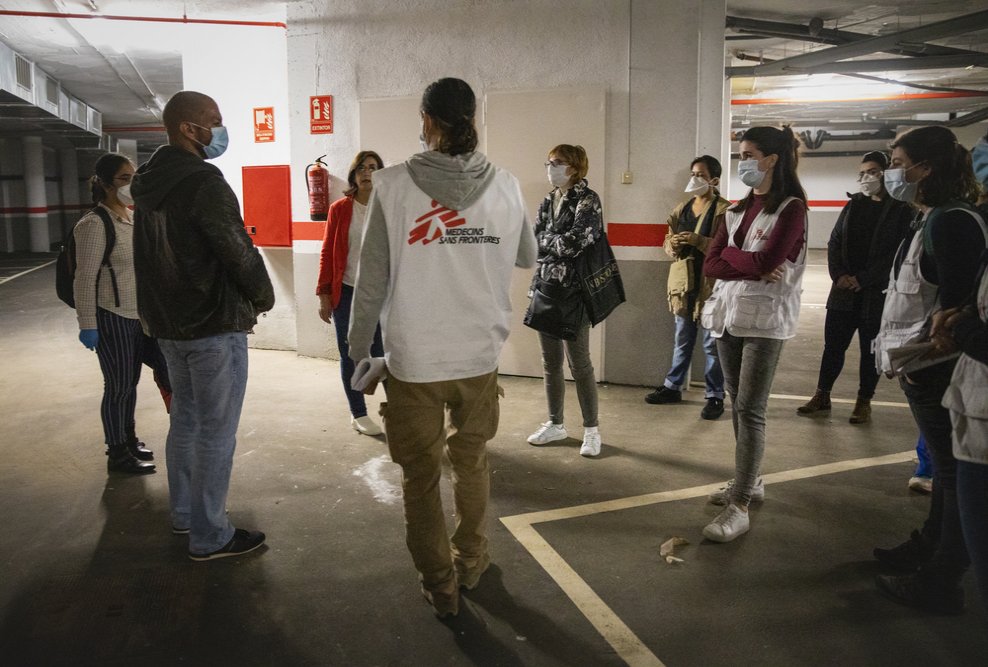 MSF coordinator at Accent Social, showing her the circuits prepared to prevent infections among the care home staff. 