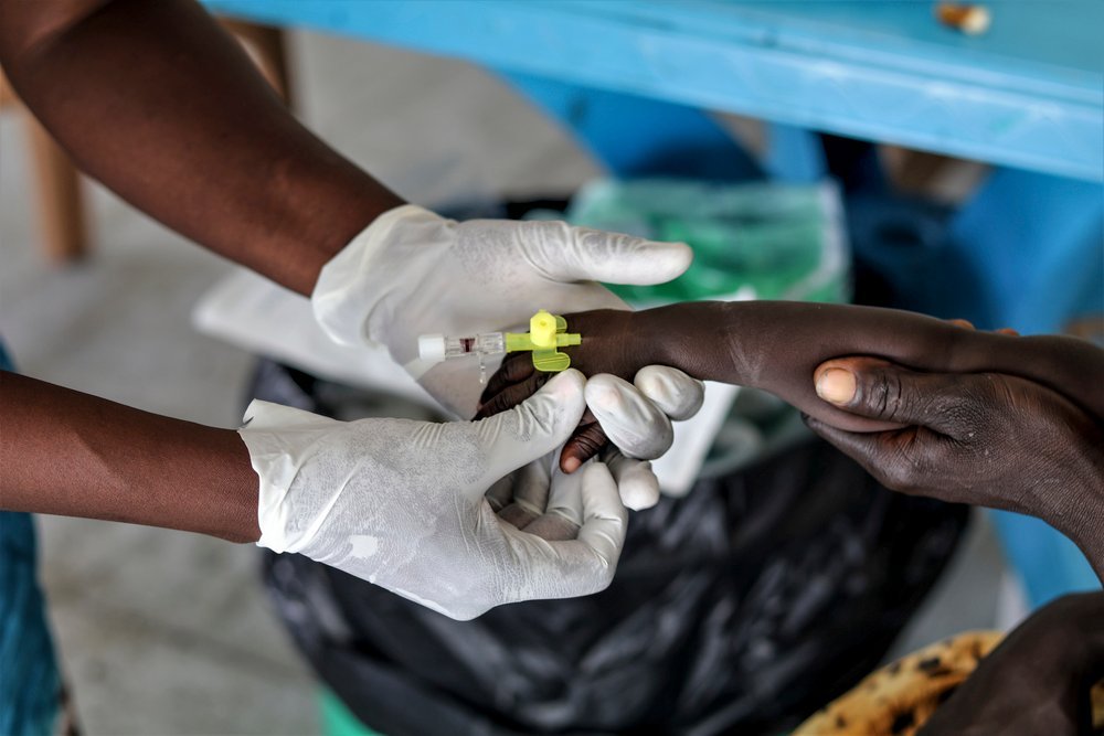 South Sudan. The Greater Pibor Administrative Area. Pibor Town. September 9, 2020. An MSF’s nurse inserting an IV needle to an arm of a patient with severe malaria and measles in Pibor town.