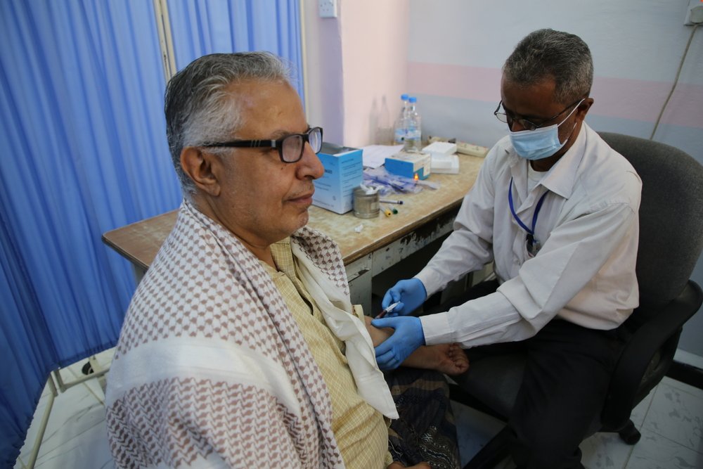 Laboratory technician, Rashad Mansoor, taking blood sample of Ahmad Muhammad Hasan for necessary tests before a blood donation at the main laboratory of Al Jamhouri hospital supported by MSF in Taiz City, Yemen.