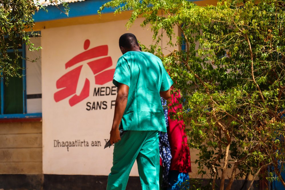 A nurse walks a patient into the consultation room in MSF&#039;s hospital in Dagahaley.