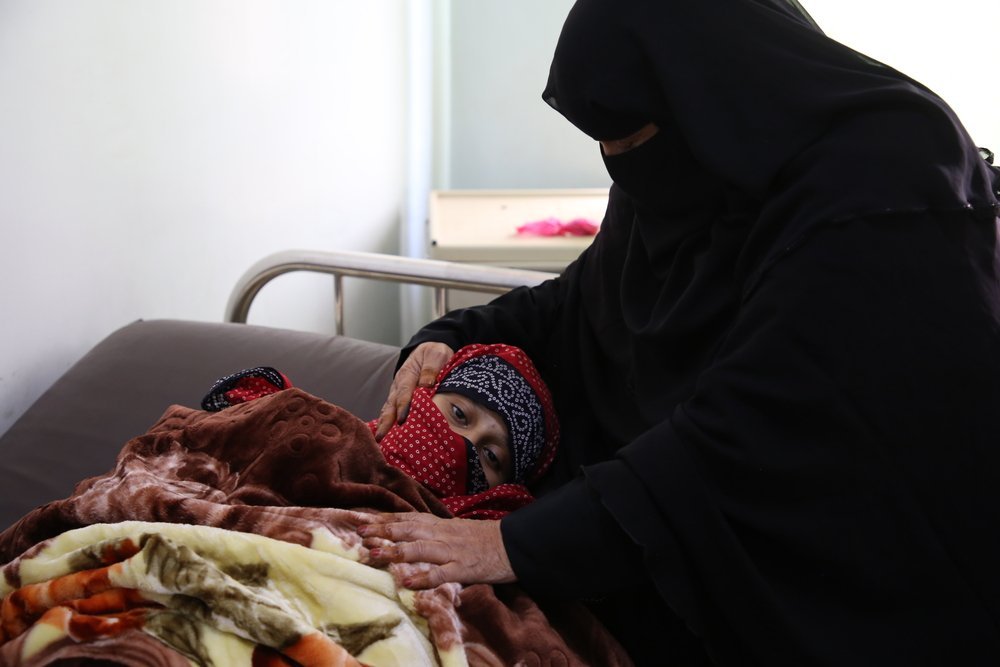 Maneia Abdul Qadir comforts her daughter Sajida who lost her newborn baby, born prematurely.