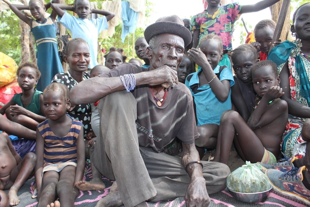 67-year old asylum seeker Gatluak* from Akobo county in South Sudan’s Jonglei State sleeps outside with his children and grandchildren.