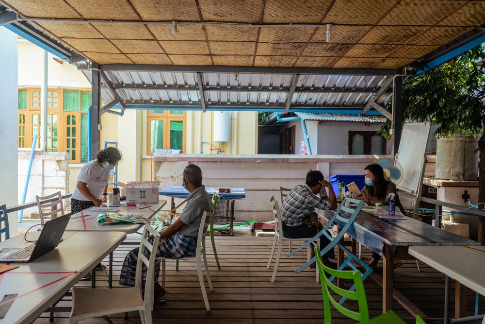 Two HIV/hepatitis C co-infected patients receive consultations in Yangon&#039;s MSF offices.