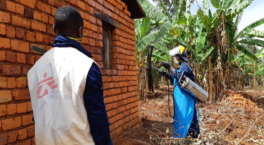 A sprayer is treating a house against mosquitoes during the 2019 indoor residual spraying campaign in Kinyinya health district.