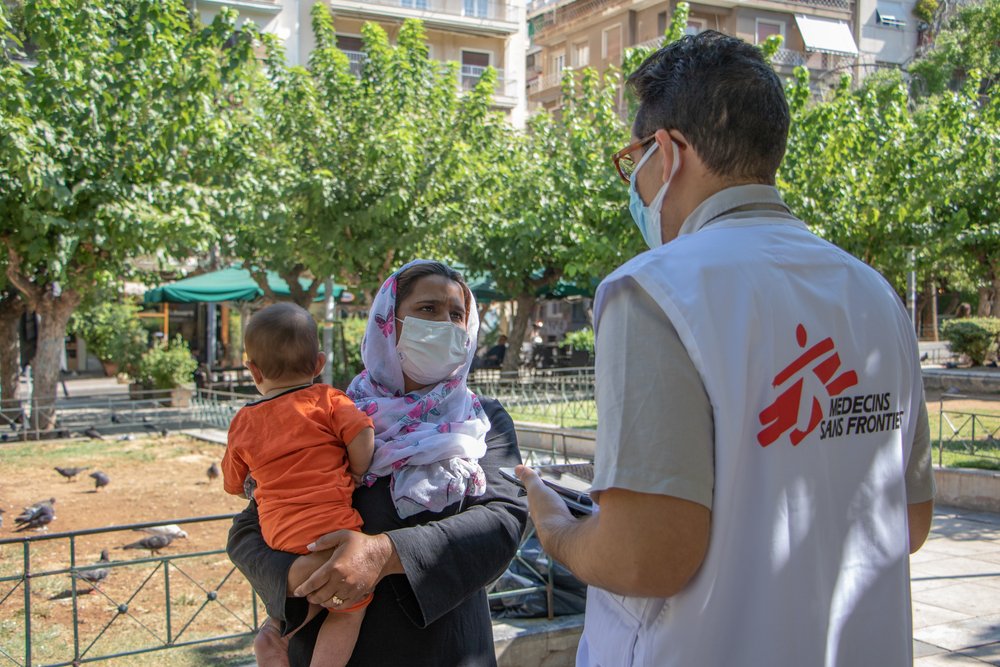 An MSF health promoter discusses with a woman in Victoria square, Athens, regarding access to the COVID-19 vaccination process. (August, 2021).