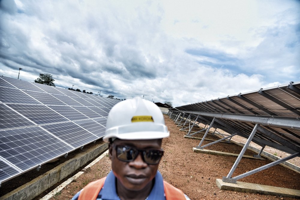 MSF logistics supervisor Mohammed Korma stands amid the solar panels that MSF has installed in Kenema district. MSF is aiming to run the Hangha hospital fully with clean energy in the future.