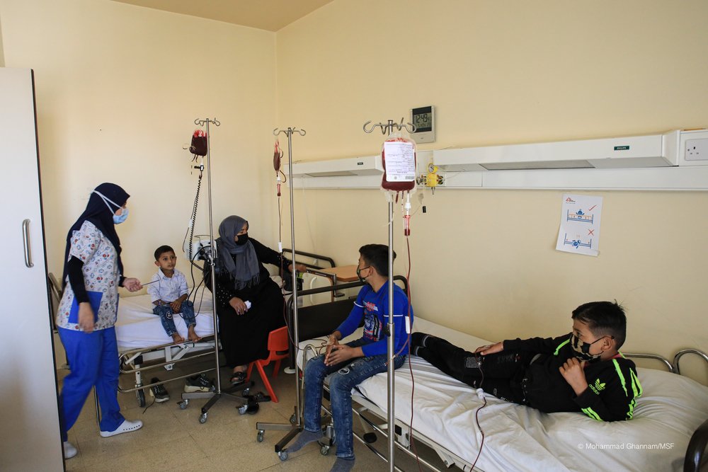 Children receive blood transfusions to help them survive thalassemia.