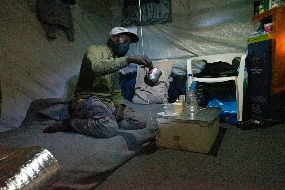 Ebo, 35, from Cameroon inside his tent in Vathy centre. Ebo is from Senegal. He left his home country because his life was threatened and with the hope he will be able to build a new life, but after 2 years in Samos camp, he is struggling to have hope.