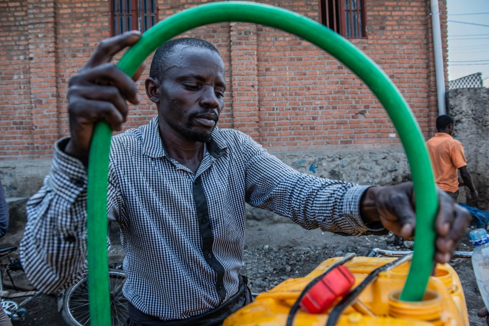 &quot;To avoid making the population suffer even more or making them sick, we do not sell water from the lake but that from the tap&quot; - Jean-Claude Bazibuhe