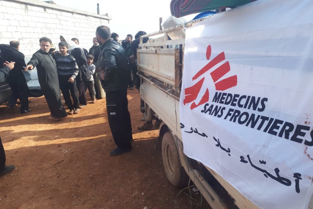 MSF distributes relief items and provides water to newly displaced people in a camp in northwest Syria, May 2019.