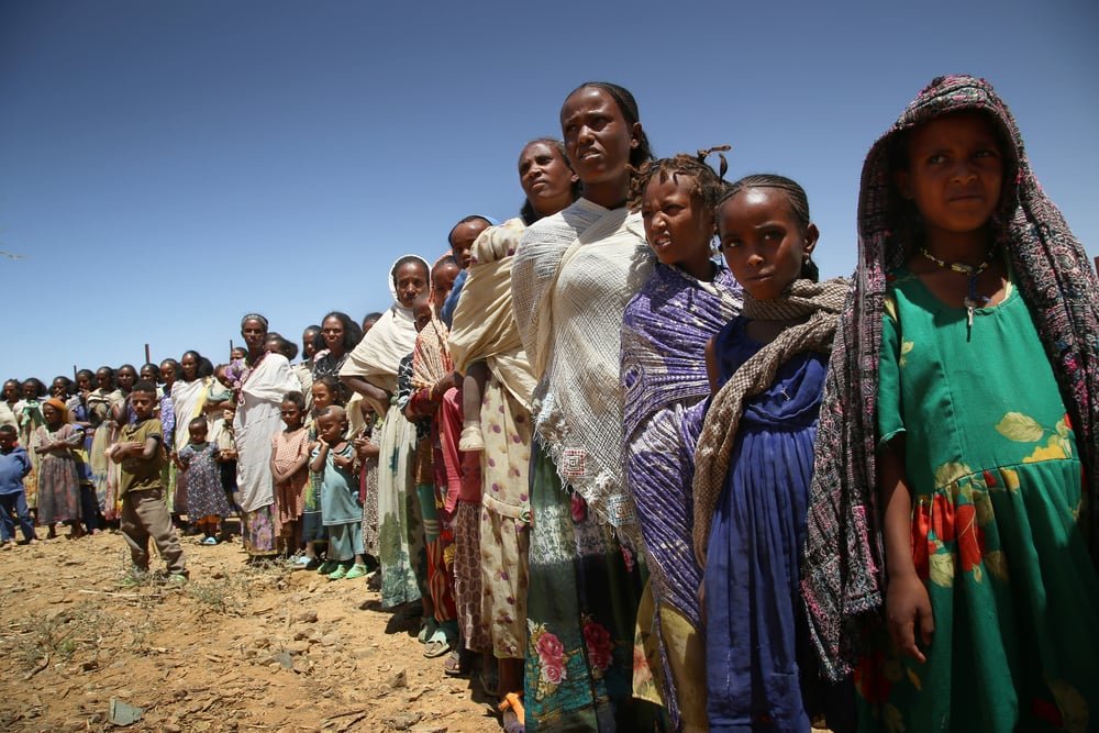 Women line up with their children to wait for a medical consultation during a mobile clinic run by MSF in Adiftaw, a village in the northern Ethiopian region of Tigray.