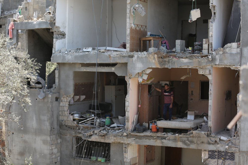 Palestinian man stands inside destroyed apartment in Gaza city. 11 days of Israel’s intense aerial and ground bombardments has caused a huge impact on people’s lives in Gaza - people lost their family members, their homes and livelihoods. 