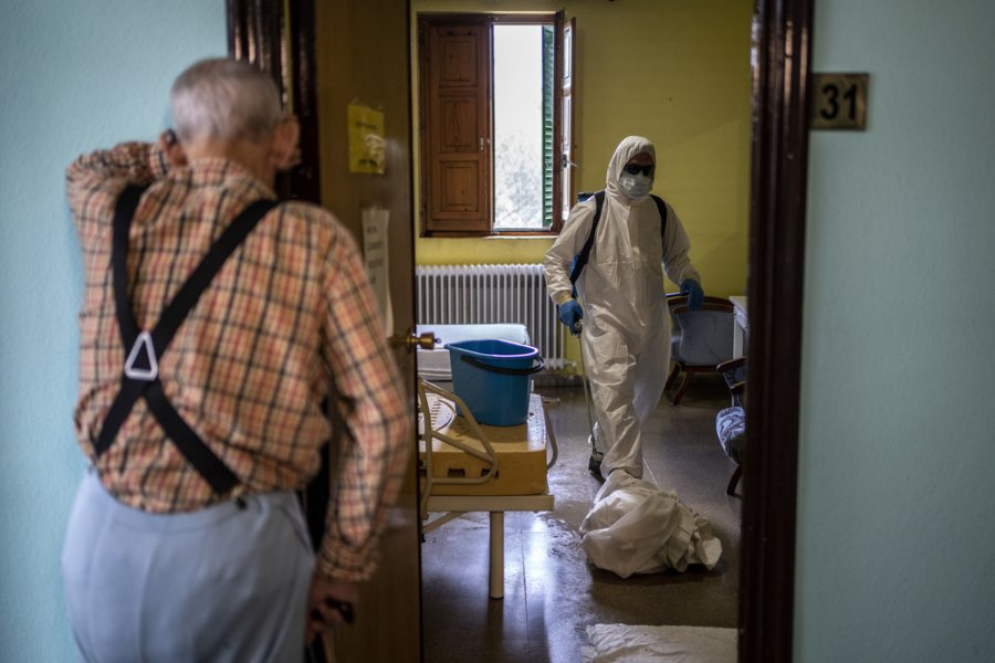 Local fire brigade members disinfecting elderly care home Residencia Nuestra Señora de las Mercedes in El Royo, Soria province, Spain. 
