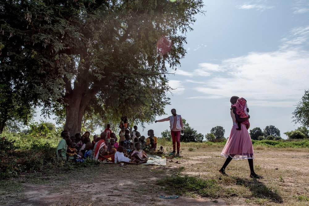 People from the local community wait to receive seasonal malaria chemoprevention medication in a village in Aweil Town, South Sudan, October 28th, 2021.