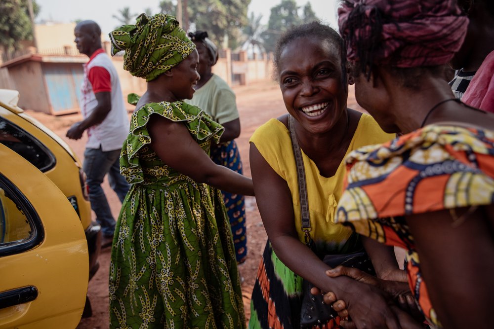 Claire, France&#039;s sister, smiles as she says goodbye to other MSF patients’ families on 22 January 2021, at the gates of the MSF’s SICA Hospital. During her hospitalisation, France&#039;s family slept outside, waiting for visiting hours, and took care of her.