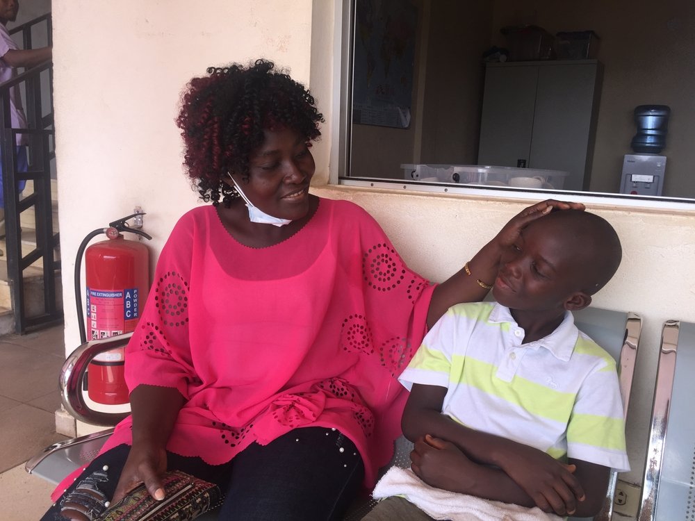 Paul B. Morris Jnr and his mother Lydia reunited with physician assistant George and nurses Jolena and Roseline, some of the staff who cared for him in the MSF Children’s Hospital, Monrovia, when he was critically ill with cerebral malaria. November 2020.
