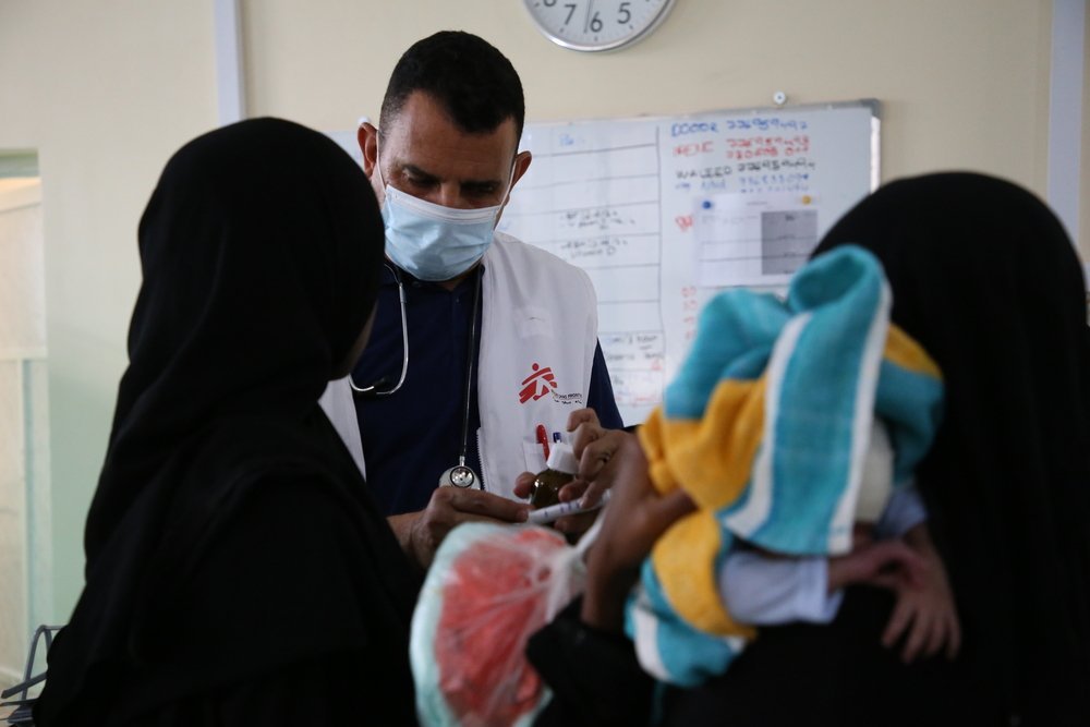 MSF doctor, Waleed, with Jamila and her baby Elwah, who came to the Al Qanawis Mother &amp; Child Hospital for the birth. Elwah was admitted to the neonatology unit with a fever and a suspected infection.