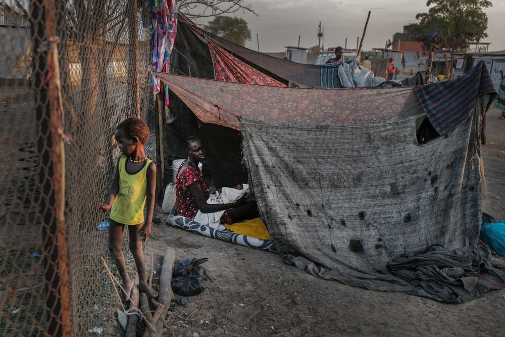 Nowal and her one-month-old baby Hoa live in a makeshift camp for displaced people in Rubkona town. (November, 2021).