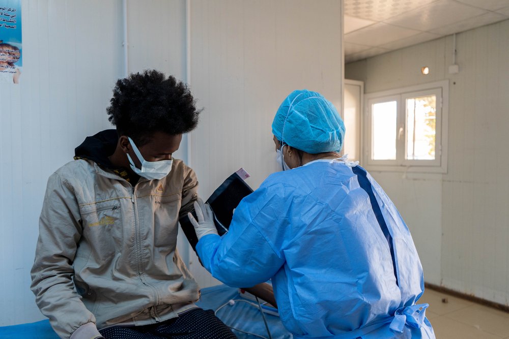 MSF Nurse Theresa Sanchez taking vital readings for a TB patient in Abu sitta Hospital in Tripoli. (Mar ch, 2022).