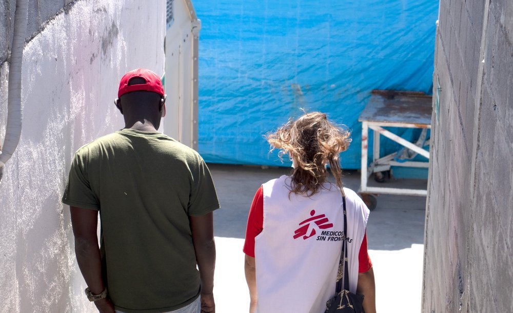 Jean Marc* and MSF Humanitarian Affairs Officer (HAO) walking and talking in the shelter “Senda de Vida” in Reynosa.