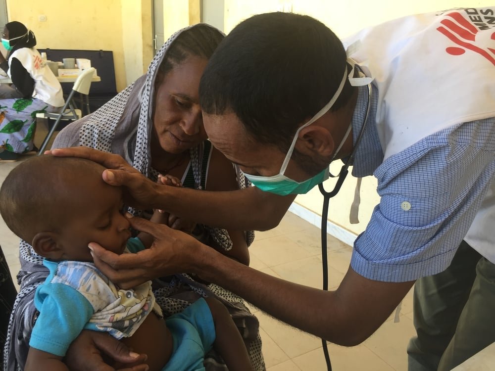 An MSF nurse, examines a child. MSF runs a mobile clinic for the displaced people living in Sokolo, Niono, central Mali.