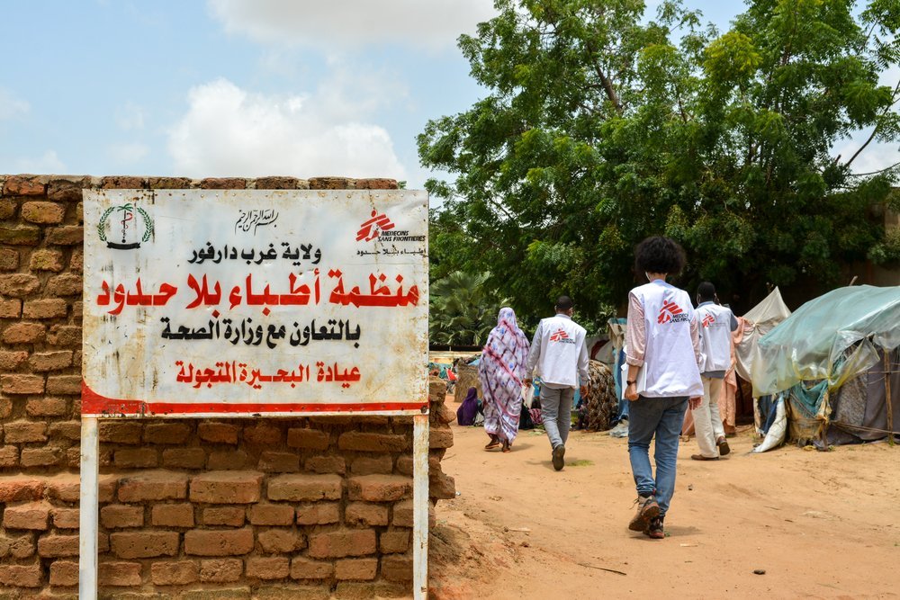MSF staff walk through Al-Buhaira school gathering site, where it operates a mobile clinic for people displaced by intercommunal violence. Conditions in these gathering sites are very poor and there is little medical care available.