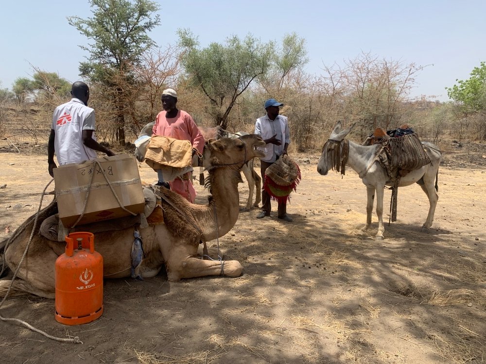 MSF teams loading supplies on a camel heading to Dilli Village, Jebel Marra Mountains, Darfur Region. Sudan