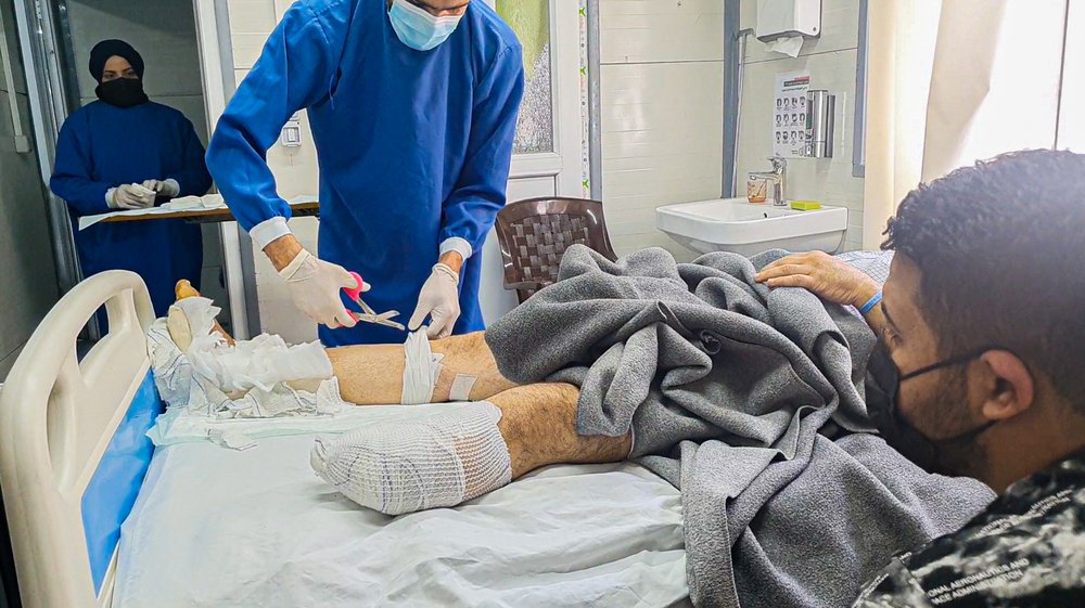 Dressing change for one of the patients in the inpatient department at Al-Wahda hospital in East Mosul. 