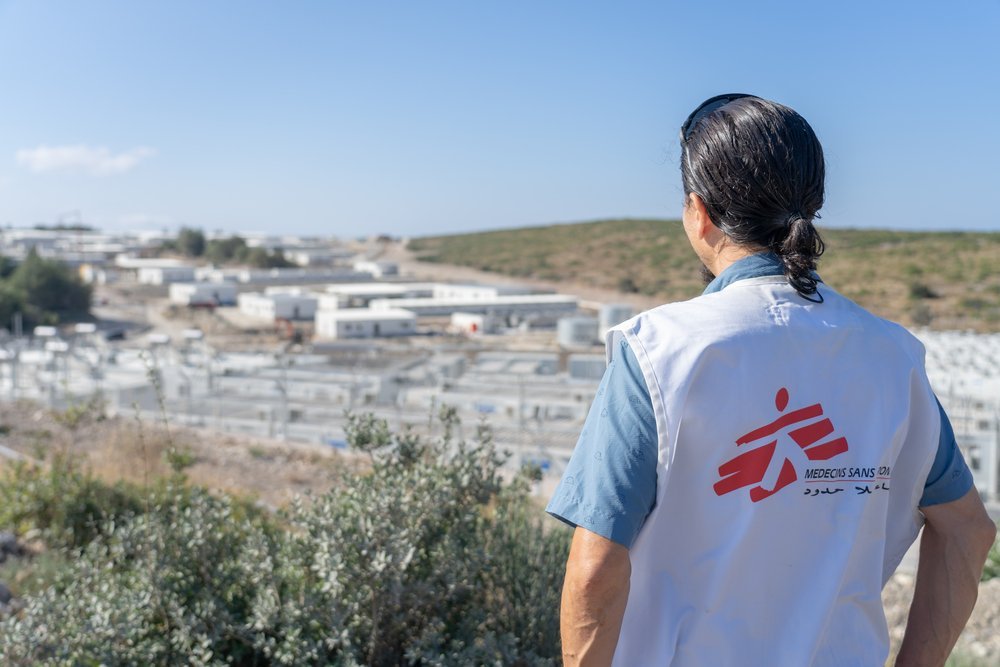 Stephen Cornish, General Director of MSF Switzerland, observes the new camp currently being built on Samos island during a visit in Greece. The brand new centre is located in the middle of nowhere and surrounded by three layers of fence &amp; barded wire.