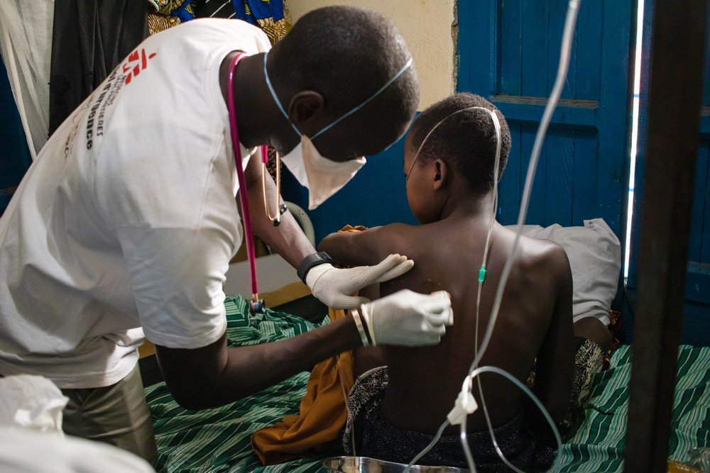 A doctor in charge of medical activities at the general referral hospital of the Nizi area, performs a puncture in the left lung of a young 14-year-old patient following a lung infection. (January, 2020).
