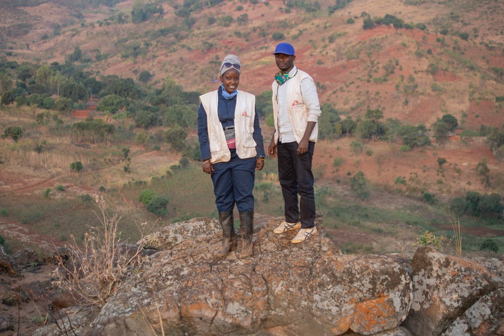 MSF supervisor Jeanine Arakaza and MSF health promotion manager Ramadhan Nzobonimpa are posing on the Ruyaga hill where teams where dispatched today to treat houses against mosquitoes.