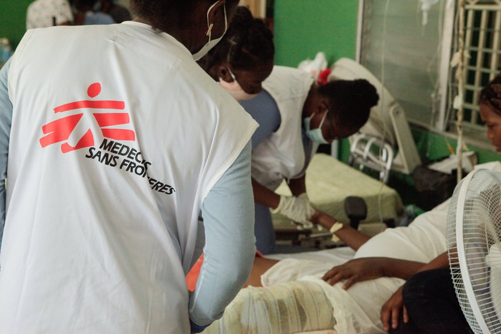MSF nurses, including a nurse supervisor Prunau Mimose (left), manage intravenous fluids for a patient in the post-operative room of the Immaculate Conception Hospital, Les Cayes, Haiti.