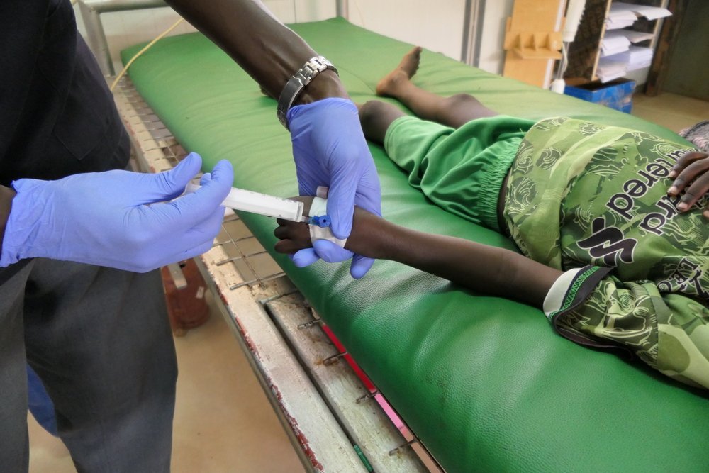 Four-year old boy with hepatitis E receives medication at the MSF hospital in Bentiu camp. He lives in a small shelter shared by seven people. On average, each of them has access to 6L of clean water per day. 