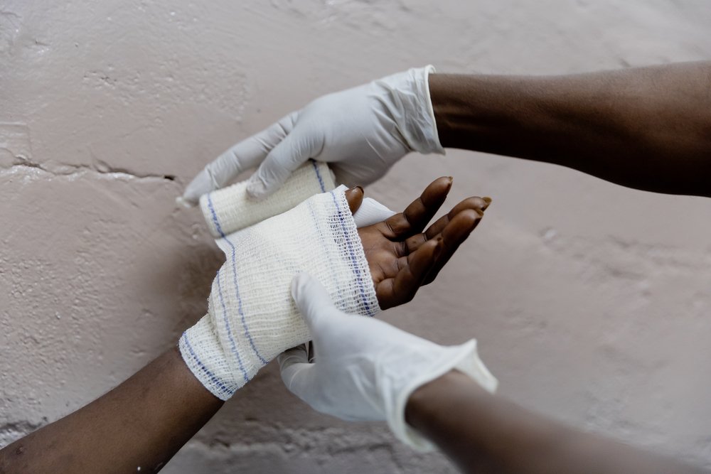 MSF staff change France’s wound dressing on 25 January 2021 at MSF’s SICA Hospital.