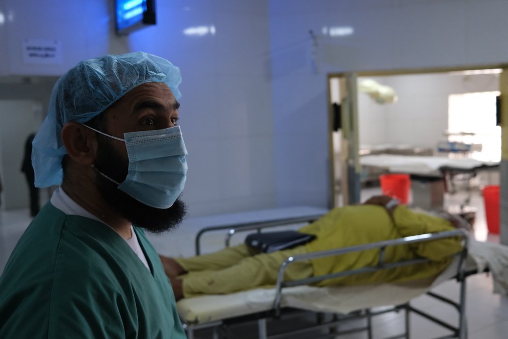 MSF surgeon Dr Mohammad Gul before performing surgery to remove a kidney stone from Esa, 63, in the operating theatre department of Boost hospital, Lashkar Gah, Helmand Province, Afghanistan