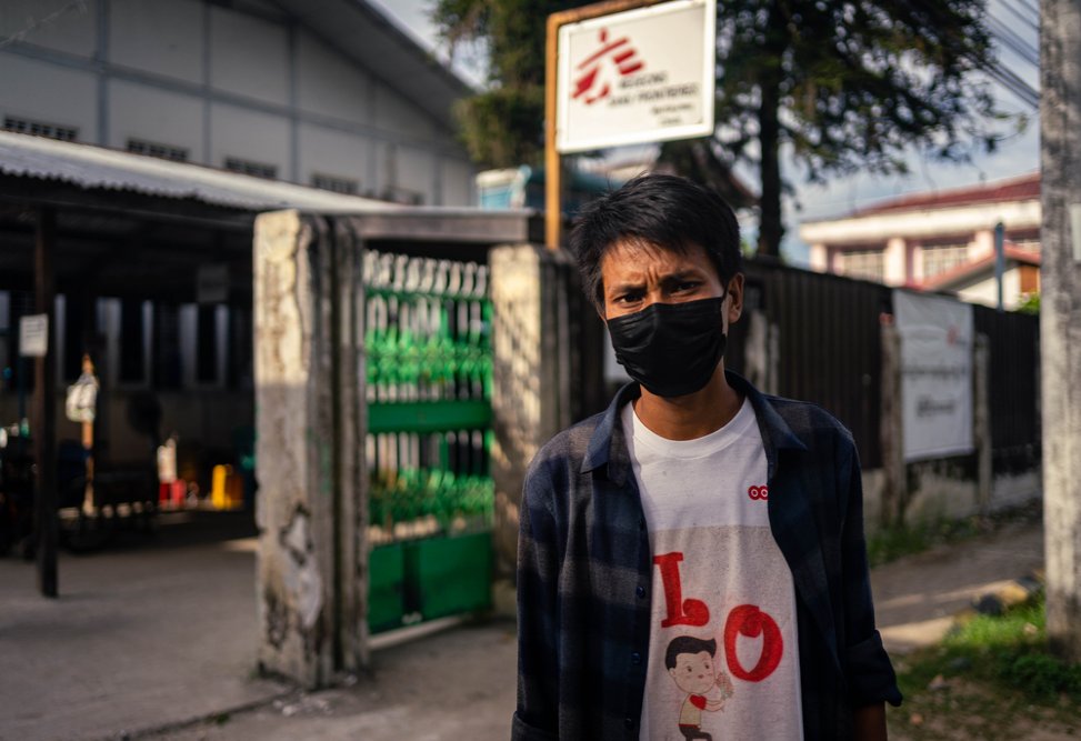 Brang Seng, 30, who was diagnosed with HIV in April 2021, stands outside MSF’s Myitkyina clinic in Kachin state.