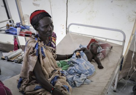 Martha with her 6-month-old grandson Kony who is recovering from a cerebral malaria in an MSF’s emergency clinic in Pibor town.
