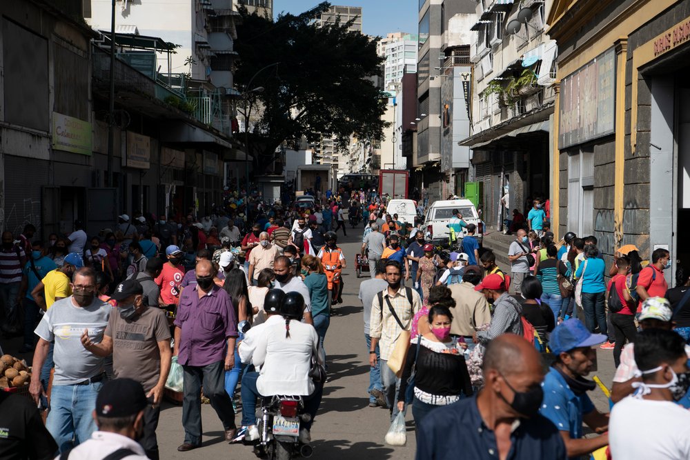 People walk through a street market in Quinta Crespo, Caracas on Wednesday.