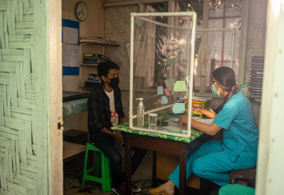 Brang Seng, 30, who was diagnosed with HIV in April 2021, undergoes a consultation with an MSF doctor at MSF’s Myitkyina clinic in Kachin state