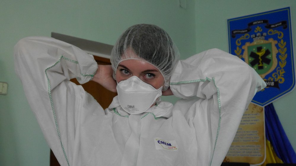MSF staff conducts training for healthcare workers on proper use of protective equipment, infection control, flow of patients – triage, screening and isolation – as well as waste management.