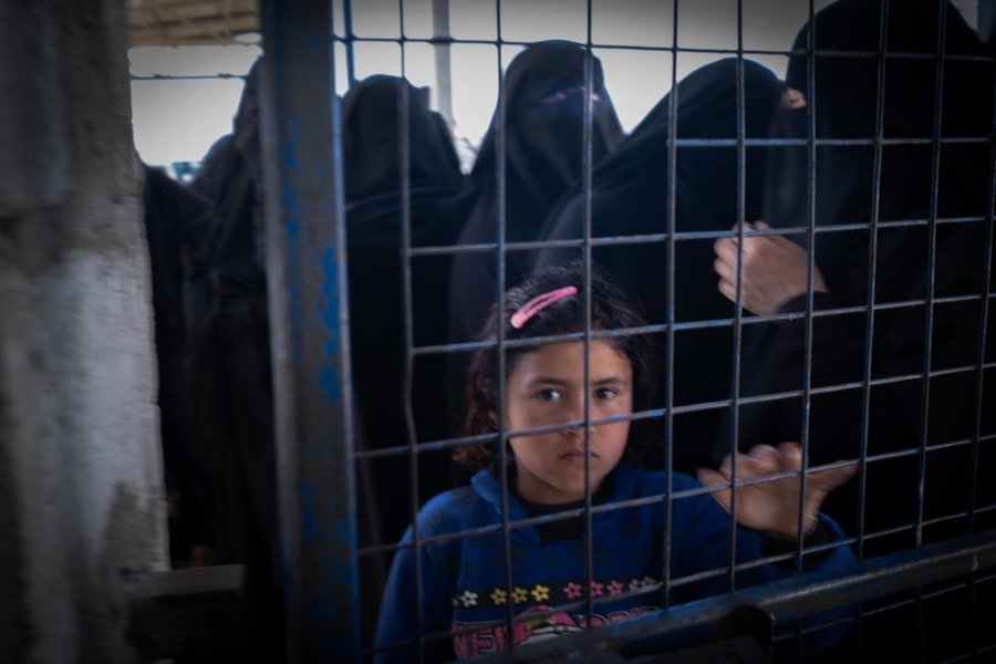 2020: A girl looks through a fence in Al-Hol camp, in northeast Syria’s Al Hasakah province. An estimated 65,000 people are being held in Al-Hol camp after fleeing the last strongholds of the Islamic State group.