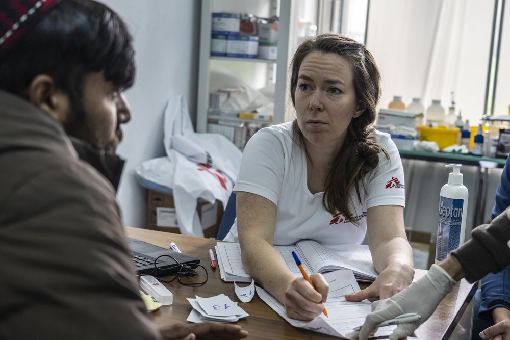 An MSF doctor exams a man from Afghanistan who is suffering from extensive skin infections in a local medical facility 2km away from Vucjak camp in Bosnia. 